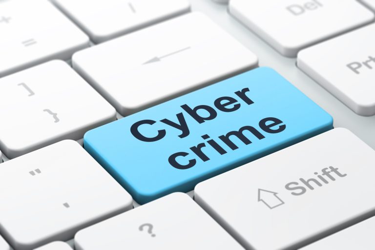 Protection concept: Cyber Crime on computer keyboard background